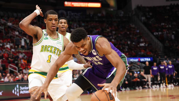 Dec 11, 2022; Houston, Texas, USA; Milwaukee Bucks forward Giannis Antetokounmpo (34) looses his dribble against Houston Rockets forward Jabari Smith Jr. (1) in the first quarter at Toyota Center. Mandatory Credit: Thomas B. Shea-USA TODAY Sports